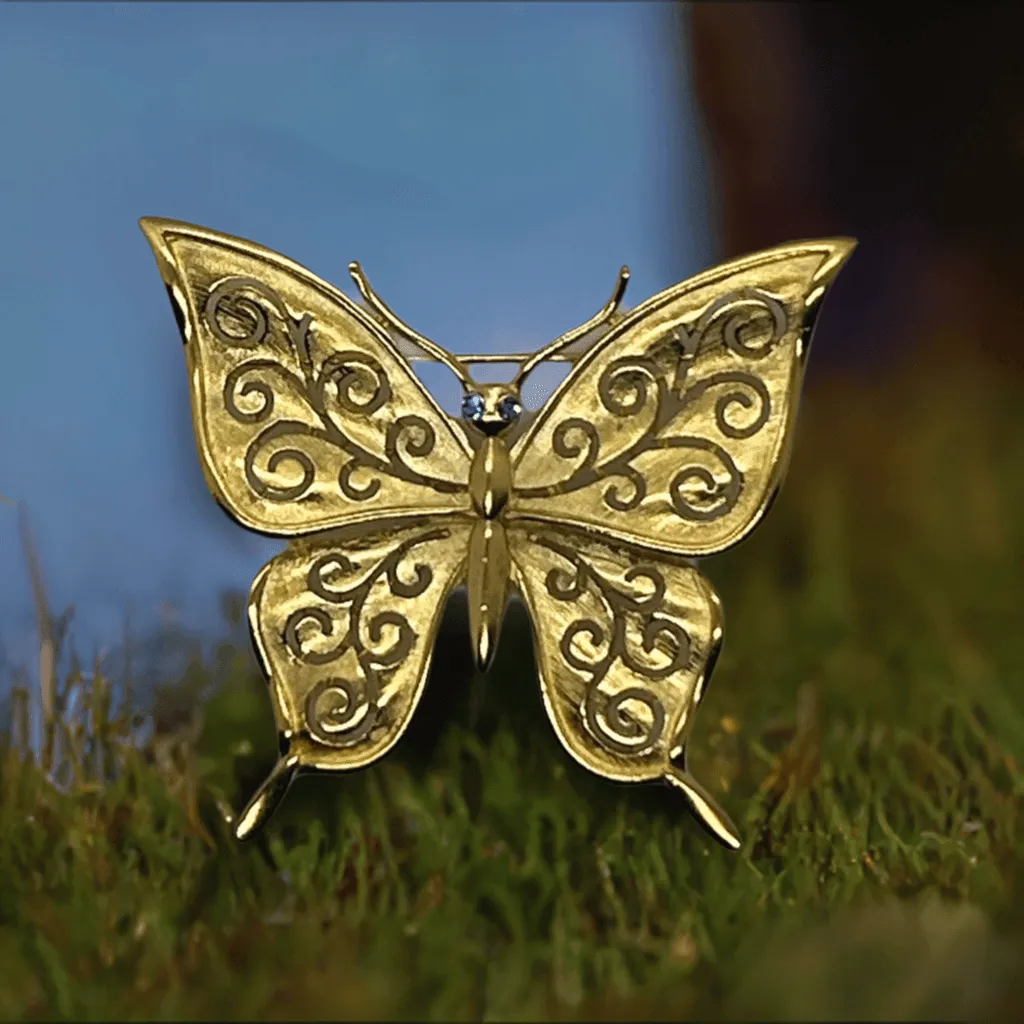 Crown Trifari Gold Tone Filigree Butterfly Brooch with Blue Eyes