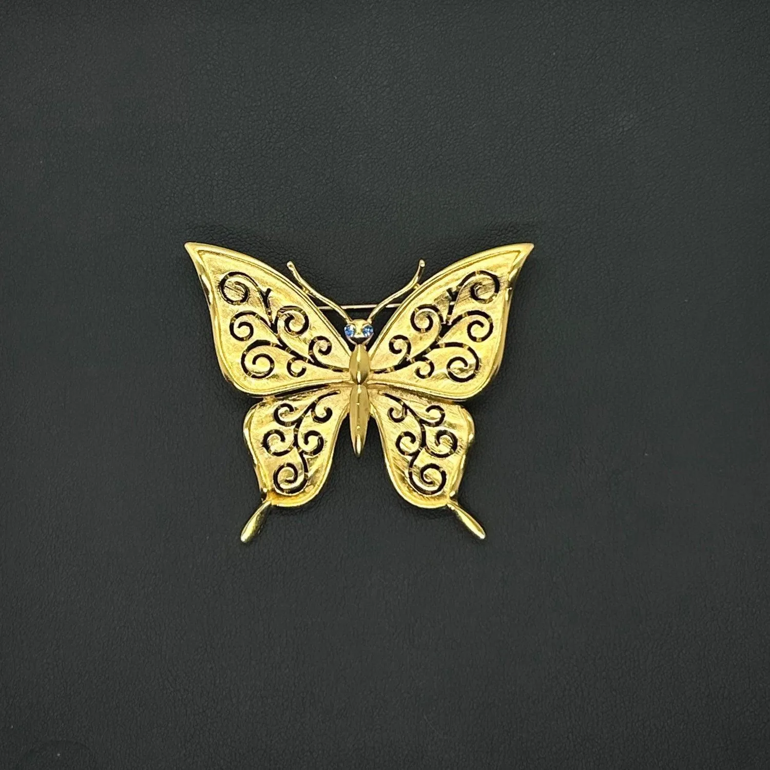 Crown Trifari Gold Tone Filigree Butterfly Brooch with Blue Eyes