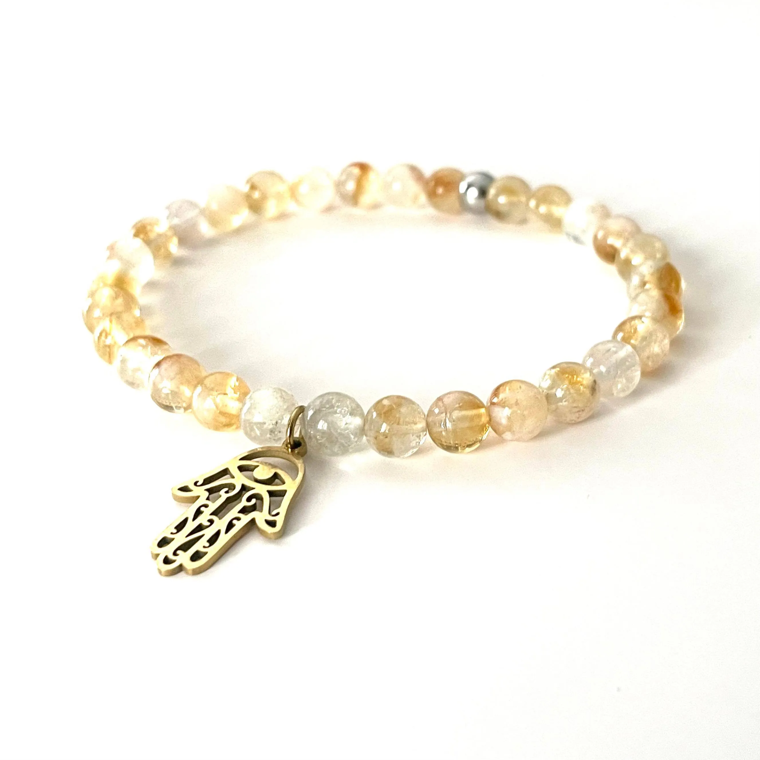 The “Charmed Citrine & Hamsa Hand Mala Bracelet