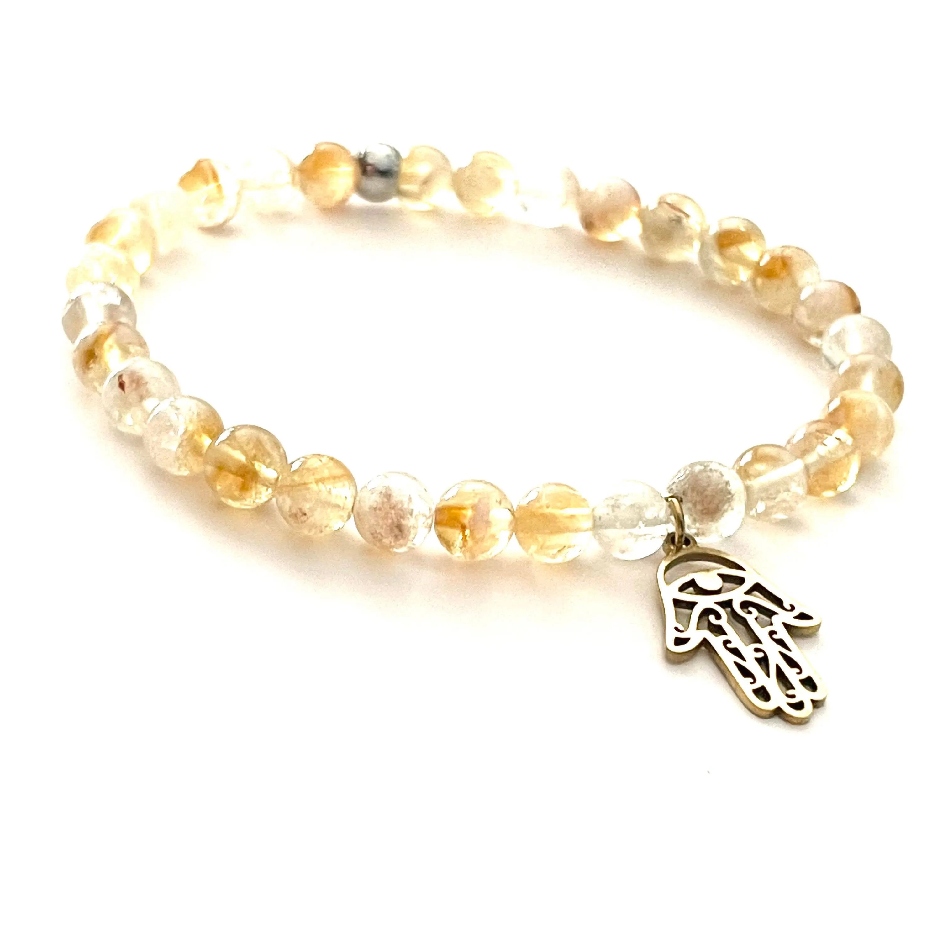 The “Charmed Citrine & Hamsa Hand Mala Bracelet